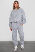 Relaxed fit fleece sweater for women with dropped shoulders and plush cozy fabric in heather  grey