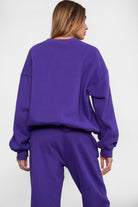 VARSITY crew neck fleece pullover sweatshirt in matching Essentials Plush Collection shades in purple 