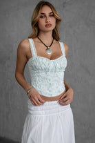 Cottage-core-inspired floral milkmaid corset top with sweetheart neckline