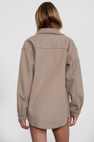 Taupe faux wool shacket with dropped shoulders and button details by Tic Toc