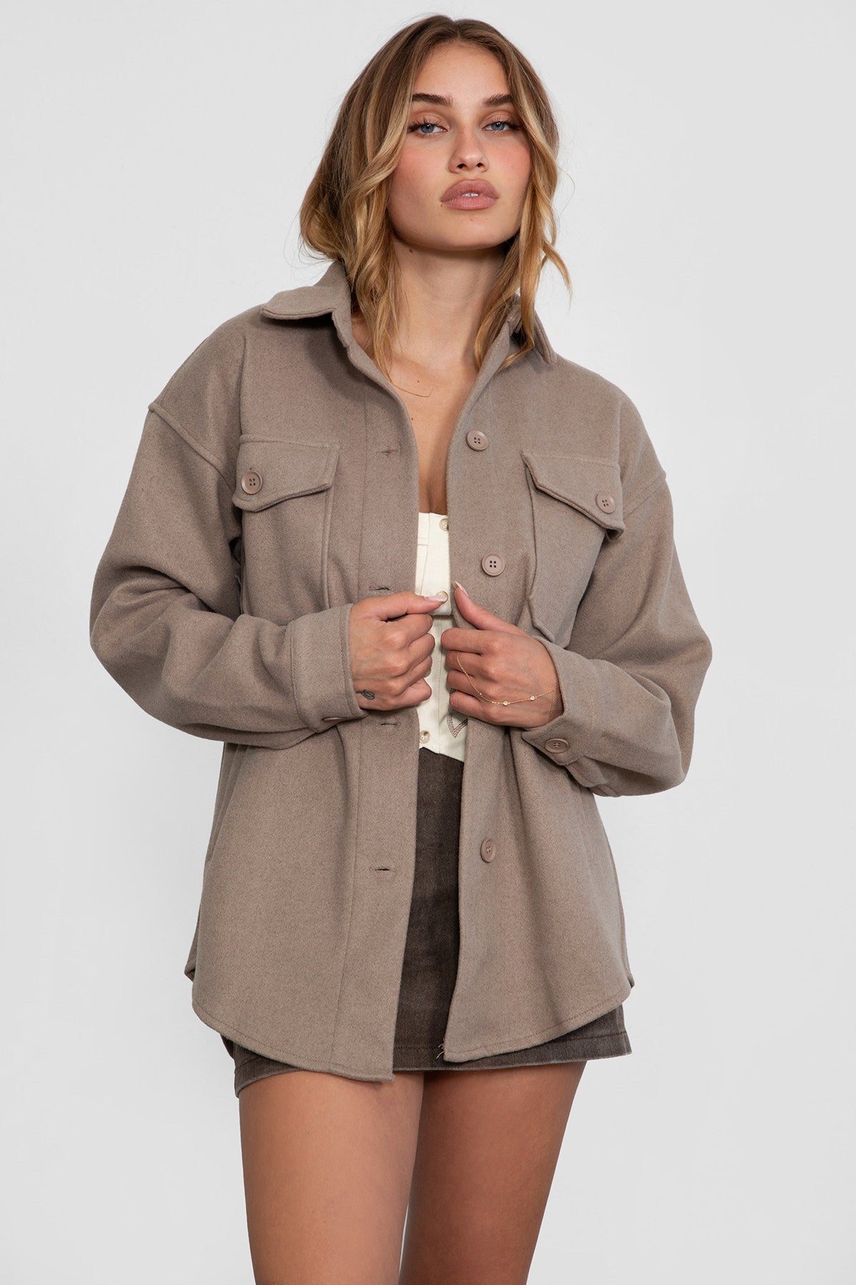 Taupe faux wool shacket with dropped shoulders and button details by Tic Toc