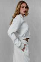 TIC TOC ROMEE Scuba Half Zip Hoodie in heather white, with a kangaroo pocket and ribbed hem