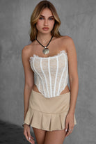 White lace strapless corset top by TIC TOC with an asymmetrical hem