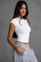 MADISON sleek white short sleeve top with hip-length fit by TIC TOC