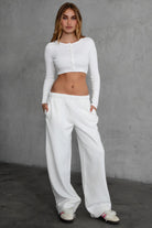 LANI wide-leg joggers in white fleece, featuring elastic waistband and adjustable drawcord