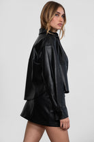 Chic black PU leather shacket with functional buttons and collared neckline