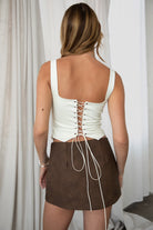 TIC TOC suede corset in cream with adjustable back and faux buttons