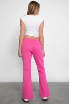 TIC TOC JIYA Essential Fleece Flare Sweat Pants in fuchsia with mid-rise elastic waistband