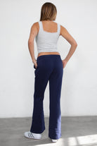 Women's flare fleece sweatpants in navy, featuring side pockets and thick fleece fabric