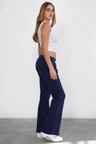 Women's flare fleece sweatpants in navy, featuring side pockets and thick fleece fabric