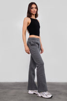 Women's flare fleece sweatpants in graphite, featuring side pockets and thick fleece fabric