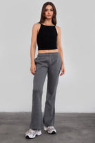 Women's flare fleece sweatpants in graphite, featuring side pockets and thick fleece fabric