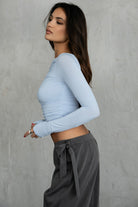 Stylish asymmetrical boat neck cropped top by TIC TOC, baby blue