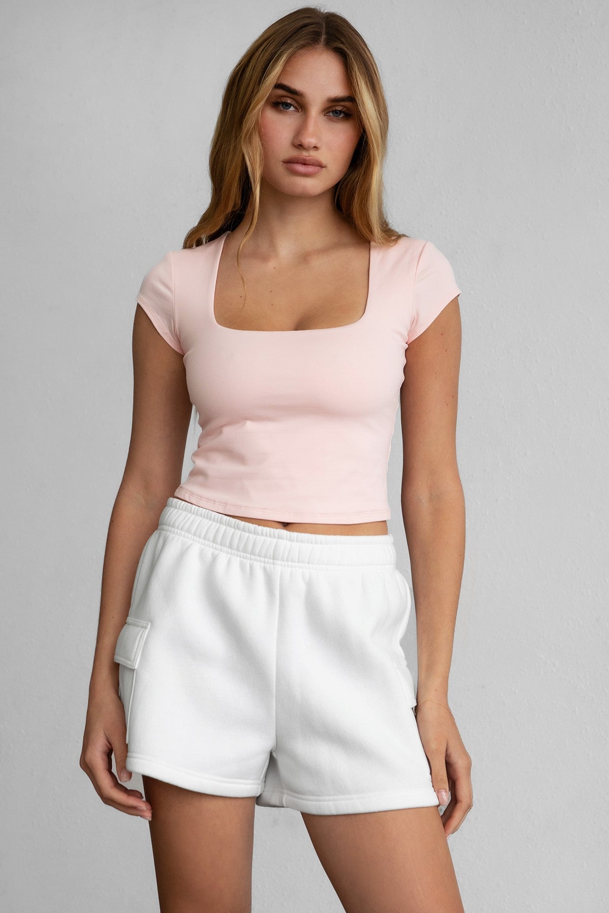 TIC TOC LAHNA Short Sleeve Baby Tee in blush, featuring a low scoop neckline and cropped fit