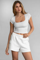 Cropped short sleeve baby tee with scoop neckline in heather white by TIC TOC