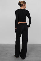 LANI wide-leg joggers in black fleece, featuring elastic waistband and adjustable drawcord