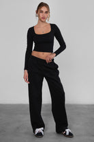 LANI wide-leg joggers in black fleece, featuring elastic waistband and adjustable drawcord