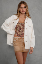 Relaxed fit LUMBER Shacket for women with button-up closure and raw cut hem