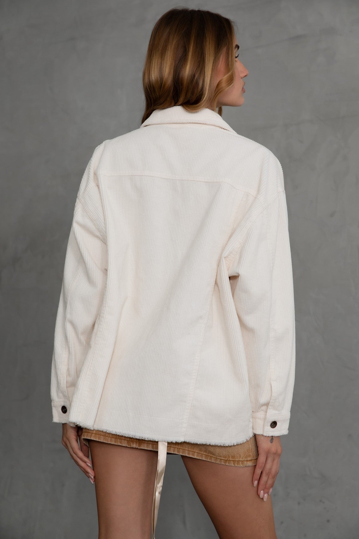 Cream-colored LUMBER Corduroy Shacket featuring dropped shoulders and dual front pockets