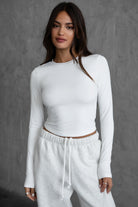 Classic white long sleeve body-hugging top from TIC TOC MADISON Sleek Collection