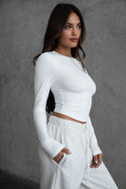 Classic white long sleeve body-hugging top from TIC TOC MADISON Sleek Collection