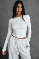 Classic white long sleeve body-hugging top from TIC TOC MADISON Sleek Collection