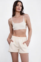 Cream fleece short set with an ultra-cropped cami top and matching high-waisted shorts by Tic Toc.