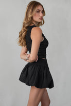 TIC TOC NADIN textured jacquard tank top in black with an asymmetric hemline