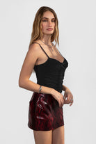 TIC TOC NAOMY snake print vegan leather mini skirt in low-rise style