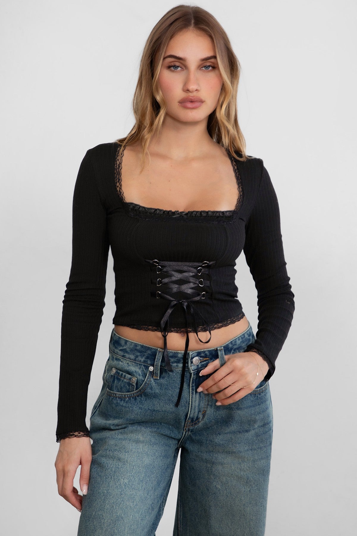 TIC TOC NAYELI ribbed knit long sleeve top with satin hems and bow detail in black