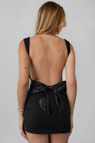 REILEY backless mini dress with satin bow in black by TIC TOC