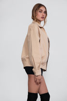 TIC TOC light khaki bomber jacket featuring elastic cuffs and waistband