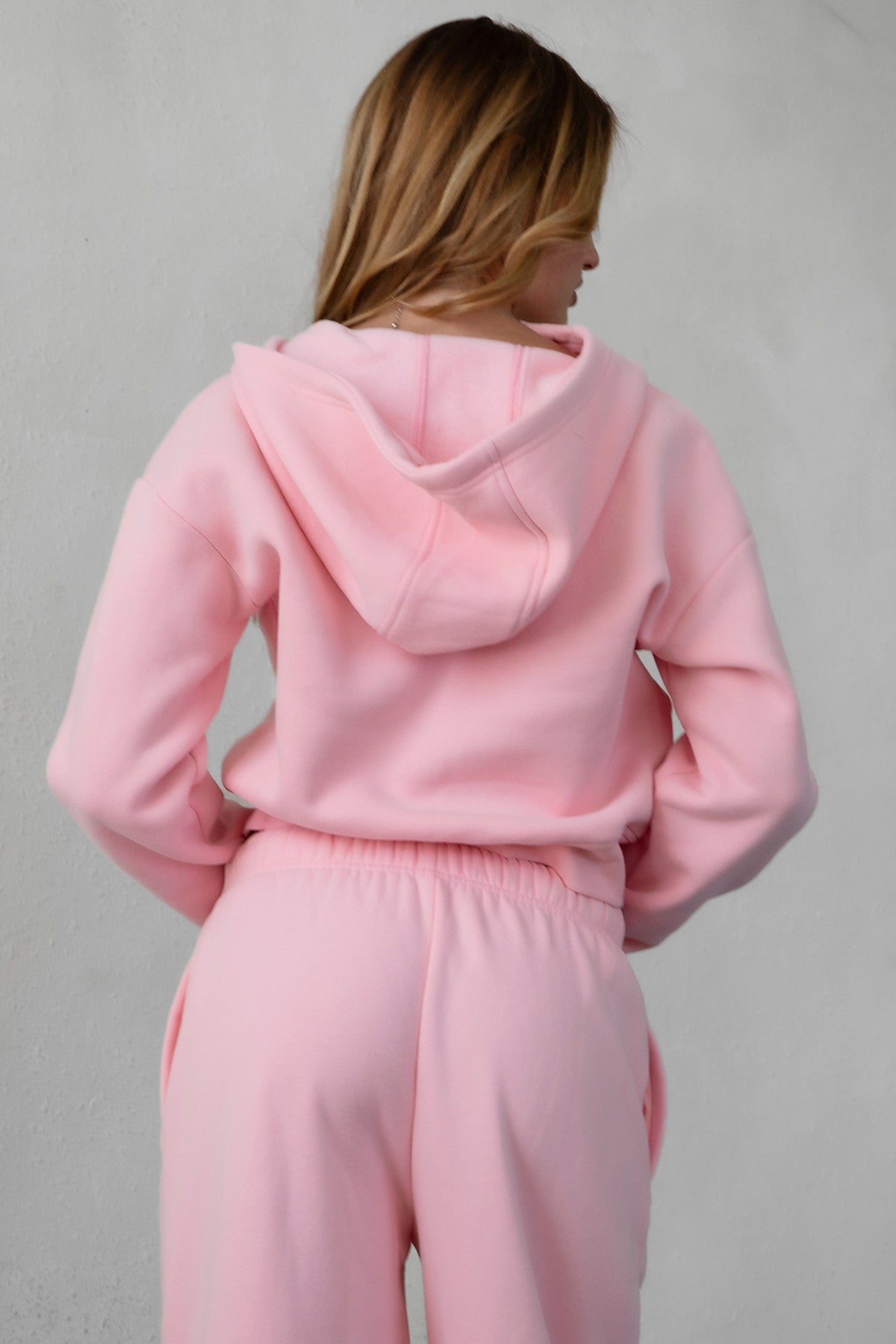 Soft fleece hoodie by TIC TOC, featuring thumbholes, in blush color