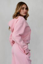 Soft fleece hoodie by TIC TOC, featuring thumbholes, in blush color