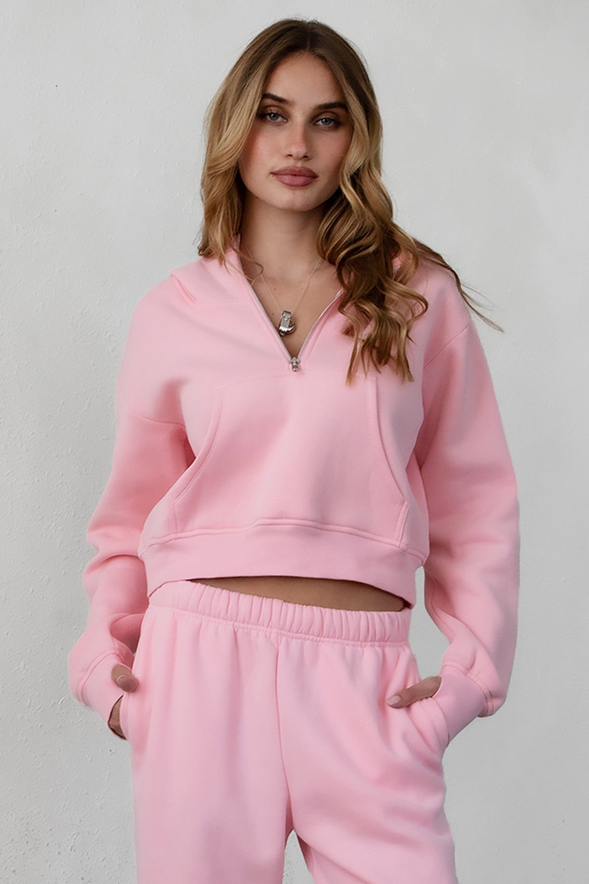 Soft fleece hoodie by TIC TOC, featuring thumbholes, in blush color