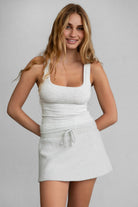 Heather white ribbed tank top with exposed bind detail, perfect for casual layering by Tic Toc