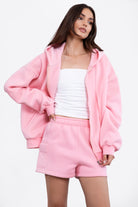 Pink mid-rise fleece shorts featuring an elastic waistband and cargo-style pockets by Tic Toc.