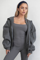 Graphite grey oversized hoodie featuring a full zipper and side welt pockets for storage by Tic Toc.