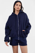  Navy oversized zip-up hoodie with a smooth fleece texture, great for layering during cool weather by Tic Toc.