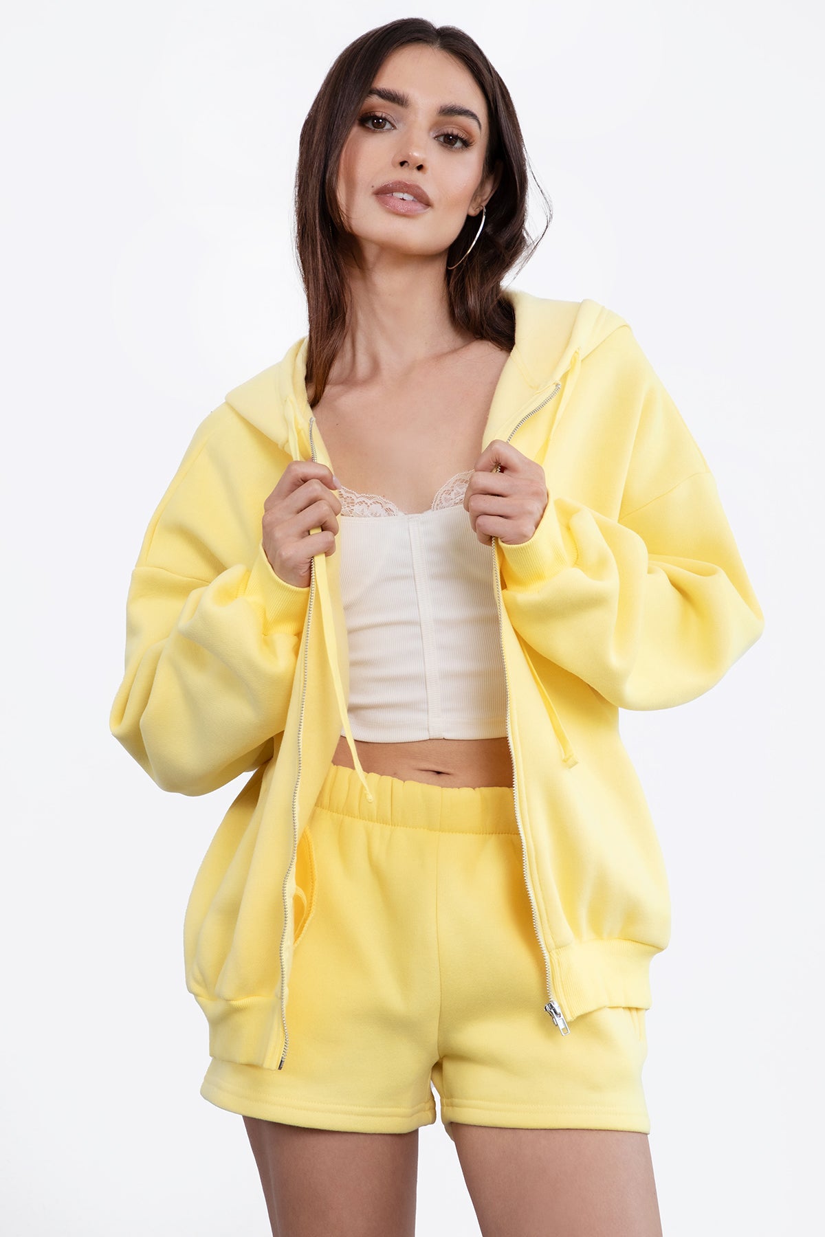  Yellow oversized zip-up fleece hoodie featuring a relaxed fit and adjustable drawstring hood by Tic Toc.