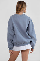 Relaxed fit fleece sweater for women with dropped shoulders and plush cozy fabric in french blue