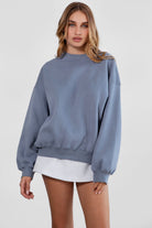 Relaxed fit fleece sweater for women with dropped shoulders and plush cozy fabric in french blue