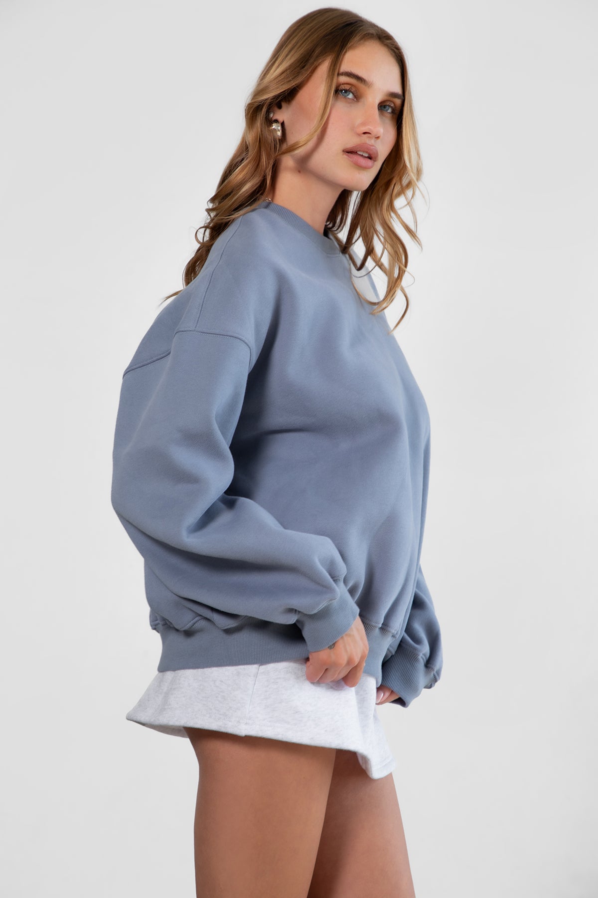 Relaxed fit fleece sweater for women with dropped shoulders and plush cozy fabric in french blue