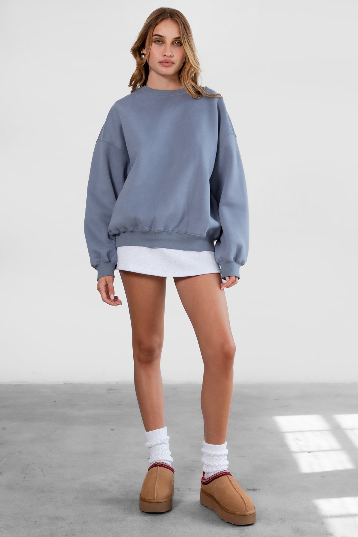 Relaxed fit fleece sweater for women with dropped shoulders and plush cozy fabric in french blue