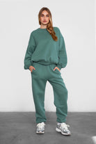 TIC TOC VARSITY oversized fleece crewneck pullover in pin green with ribbed detailing