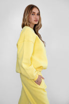 VARSITY crew neck fleece pullover sweatshirt in matching Essentials Plush Collection shades in yellow