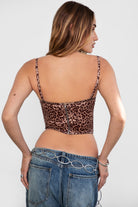 Leopard print corset top featuring sheer lace panels and adjustable straps by TIC TOC